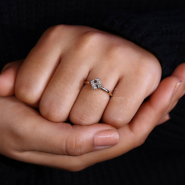 Sleek yellow gold ring with asscher cut stone.