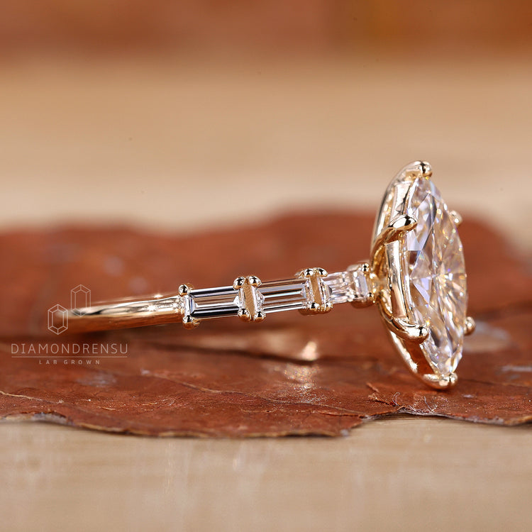 6 prong setting secures the marquise centre diamond.