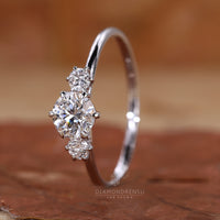 Buy engagement ring with round diamonds and claw setting.
