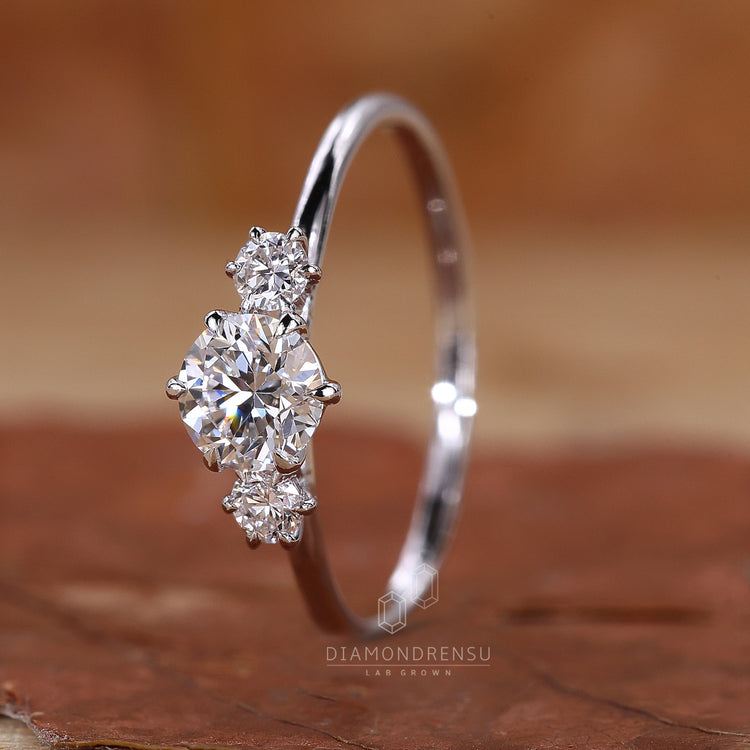 Buy engagement ring with round diamonds and claw setting.