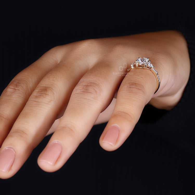Baguette and round pave band in yellow gold diamond ring.