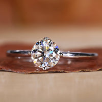 Solitaire engagement ring with a clean and minimal design.