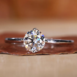 Solitaire engagement ring with a clean and minimal design.