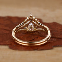 V shaped wedding band with pear cut engagement ring set.