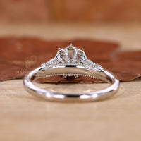 round prong ring with white gold engagement ring.