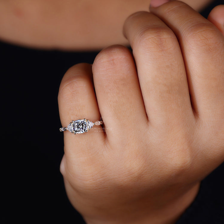 3 stone engagement ring set in 4 prong setting.