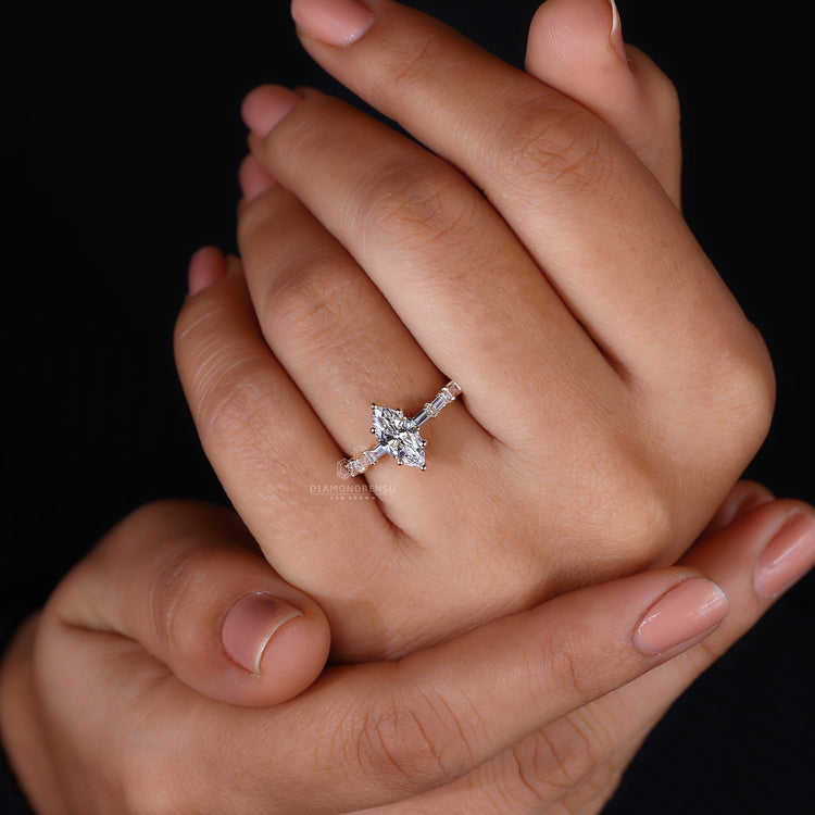 IGI certified engagement ring with baguette pavé accents.