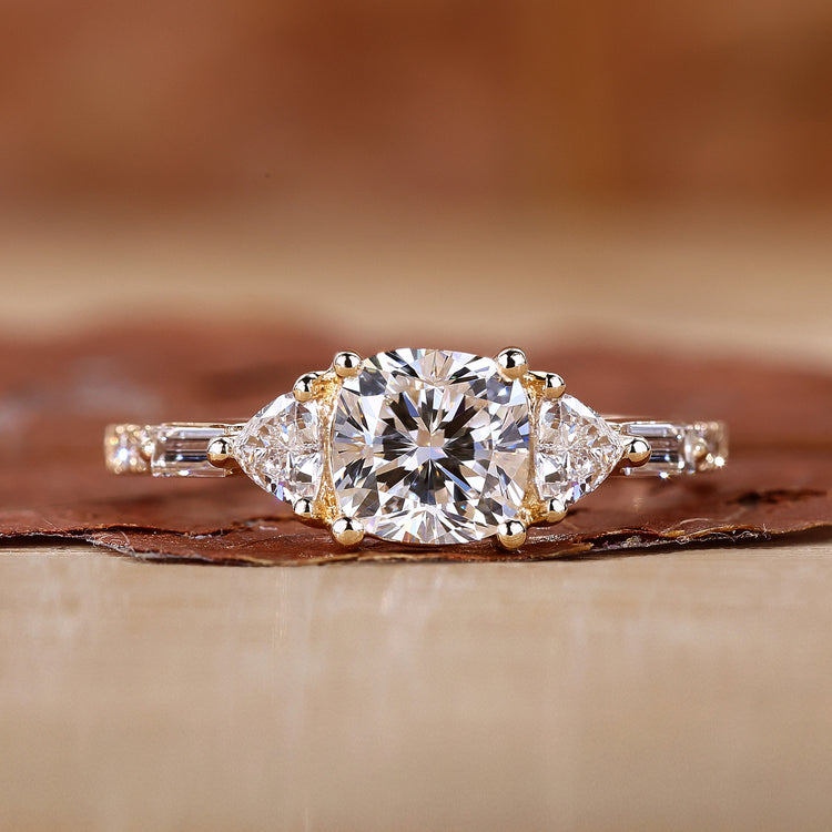 Cushion cut diamond ring with 3 stone engagement ring.