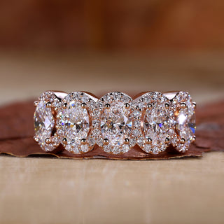 oval engagement ring in rose gold band.