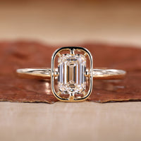 Emerald cut engagement ring with solitaire engagement ring.