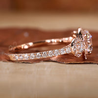 Round prong setting ring securing a brilliant centre diamond.