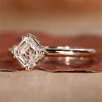 Simple diamond engagement ring with triple prong.