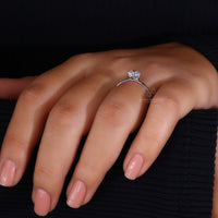Compass prong setting ring designed for a modern touch.