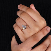 Yellow gold pear diamond engagement ring.