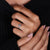 Round cut diamond side stone on elegant ring