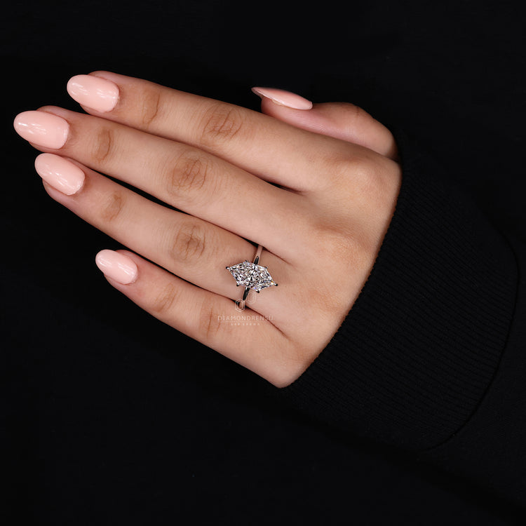 round cut hidden halo setting with solitaire engagement ring.