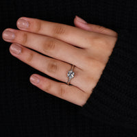 Round cut side stone ring in a trellis setting for added detail.