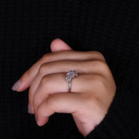 marquise round side stone on cluster engagement ring.