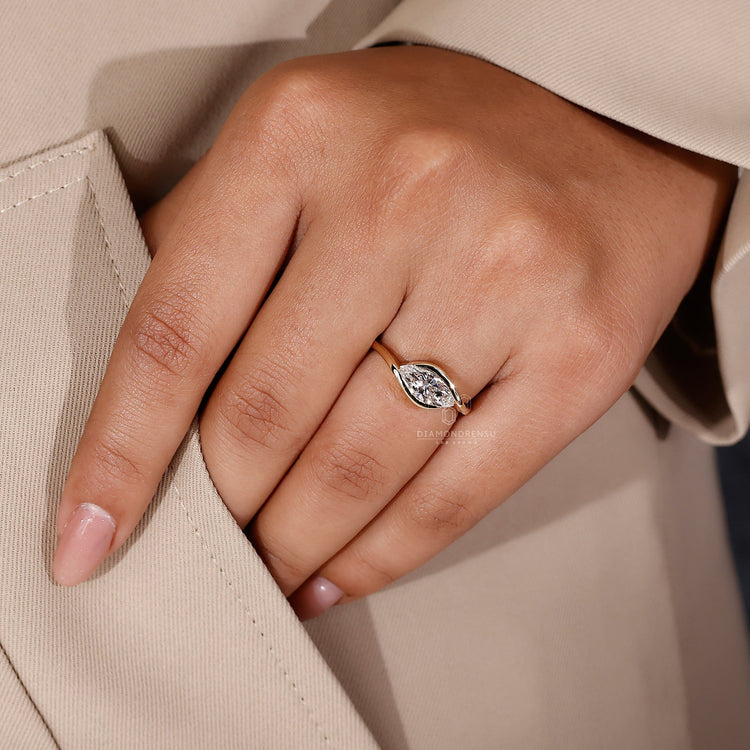 Handmade marquise cut diamond ring featuring an elegant east west design