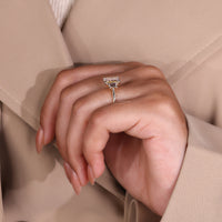 Emerald diamond ring with 3 stone engagement ring.