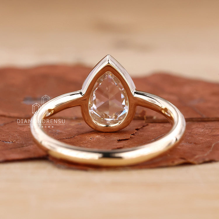 Engagement ring Australia with pear solitaire diamond.