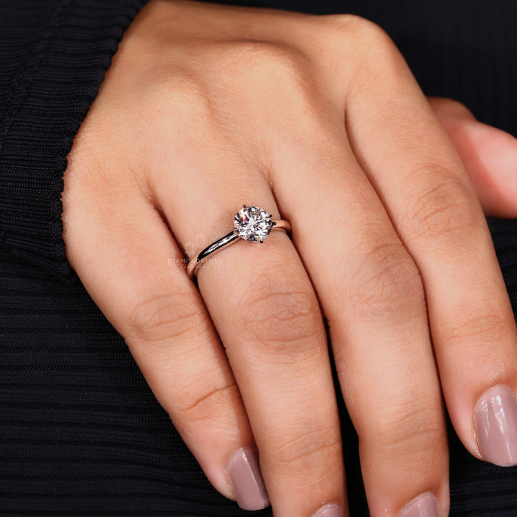 Compass prong setting used in solitaire engagement ring.