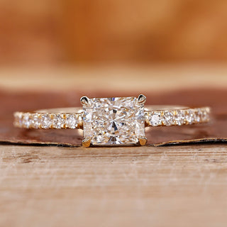 Radiant cut engagement ring in east to west setting.