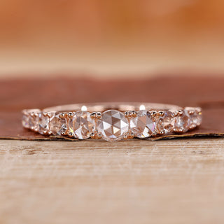 Round rose cut wedding band with shared prong setting.