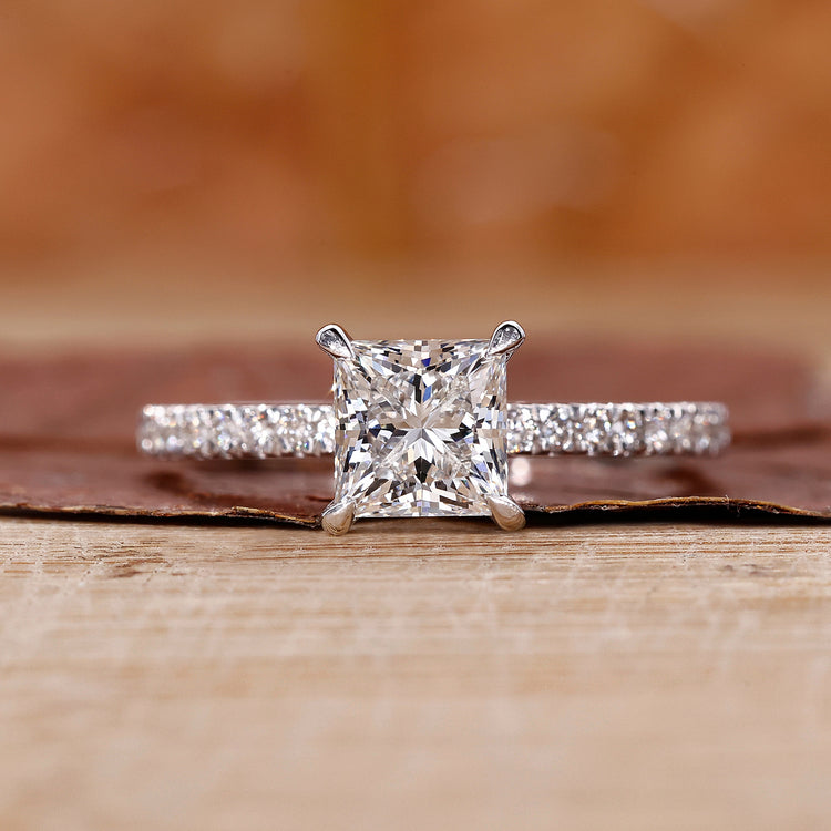 Princess cut diamond ring with 4 claw prong.