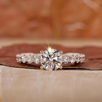 yellow gold engagement ring with prong setting.