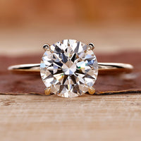 Round Diamond Engagement Ring with yellow gold setting.