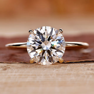 Round Diamond Engagement Ring with yellow gold setting.