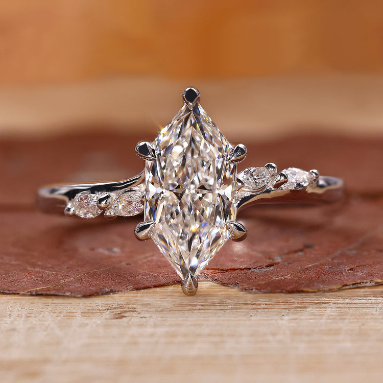 Dutch Marquise Engagement Ring with bridge accent setting.