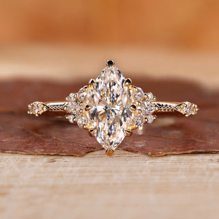 Marquise engagement ring with round side diamond.