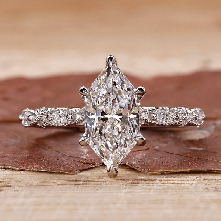 Milgrain engagement ring in white gold.