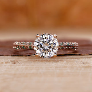 Knife edge ring with round cut diamond and pavé setting in rose gold.