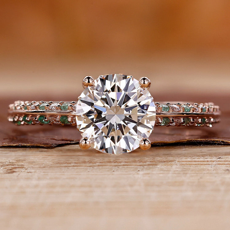 Knife edge ring with round cut diamond and pavé setting in rose gold.