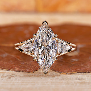 Yellow gold engagement ring with v prong setting.