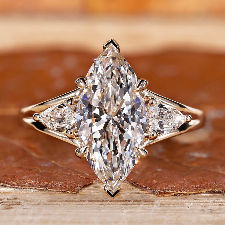 Yellow gold engagement ring with v prong setting.