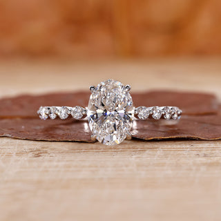 oval diamond engagement ring with floating bubble prong.