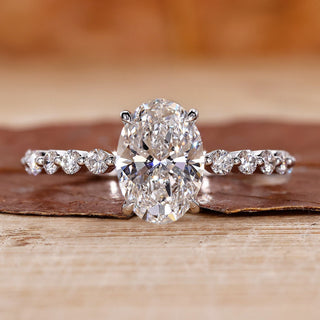 oval diamond engagement ring with floating bubble prong.
