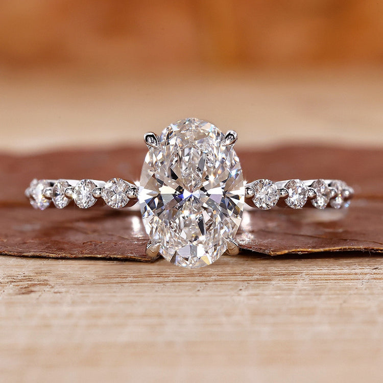 oval diamond engagement ring with floating bubble prong.