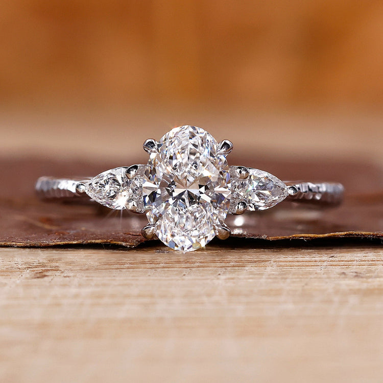 Three stone diamond ring in white gold ring.