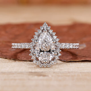 pear shaped diamond ring in pave setting style.