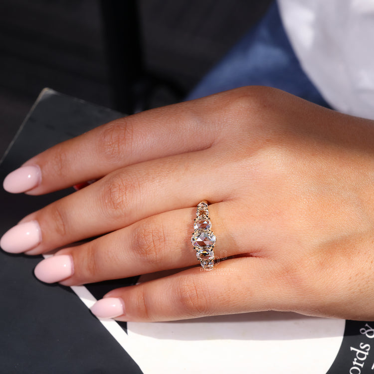 Marquise and round side stone engagement ring.