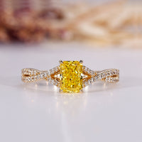 Yellow diamond engagement ring with radiant engagement ring.