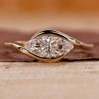 Marquise Diamond Engagement Ring on a sleek band for a modern proposal.
