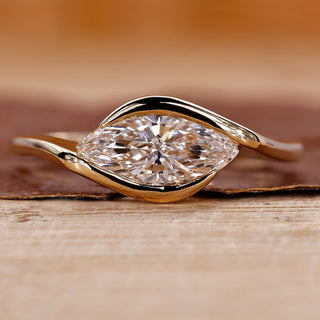 Marquise Diamond Engagement Ring on a sleek band for a modern proposal.