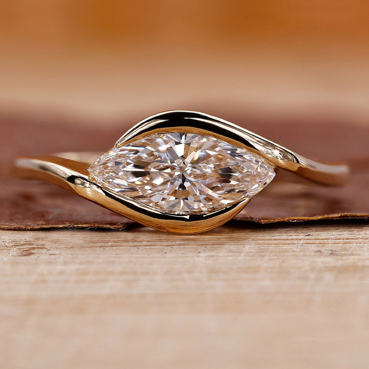 Marquise Diamond Engagement Ring on a sleek band for a modern proposal.