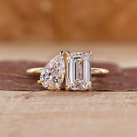 Toi et moi engagement ring with emerald and pear cut ring.